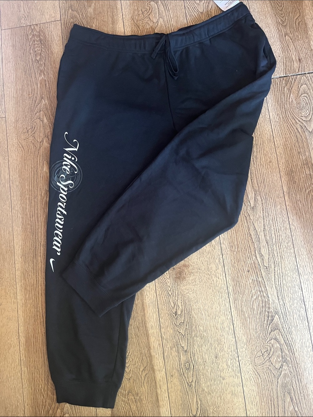 Nike Black Sweatpants with White Vertical 'Nike Sportswear' Script